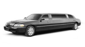 A black limo is parked in front of the camera.